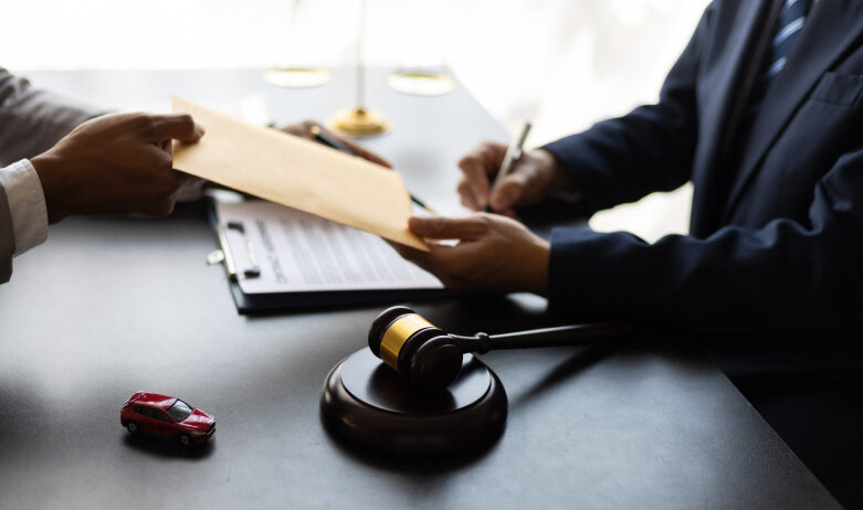 Business owner signing documents at a table