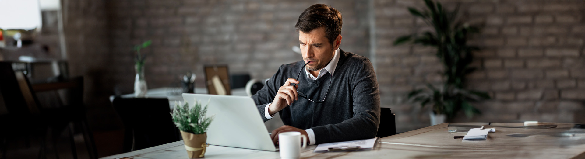 man focused while sitting at computer